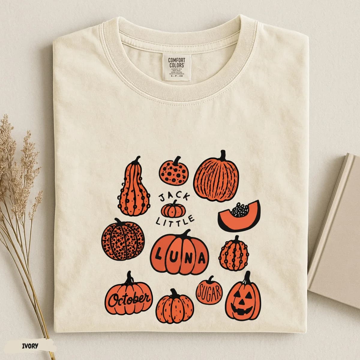 Ivory tee with a pumpkin collection design